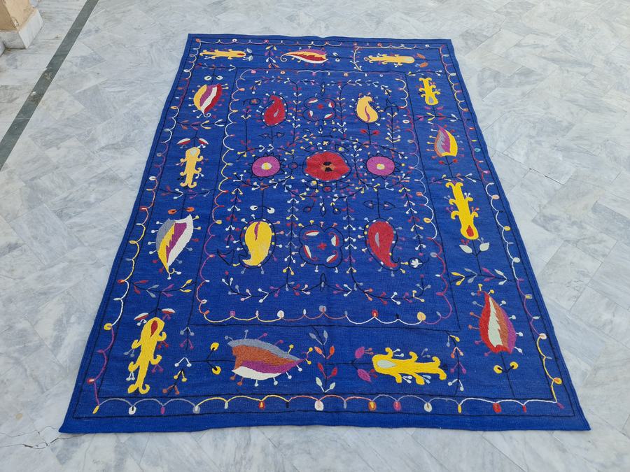 Hand-embroidered rug in blue, made to the customer's measurements
