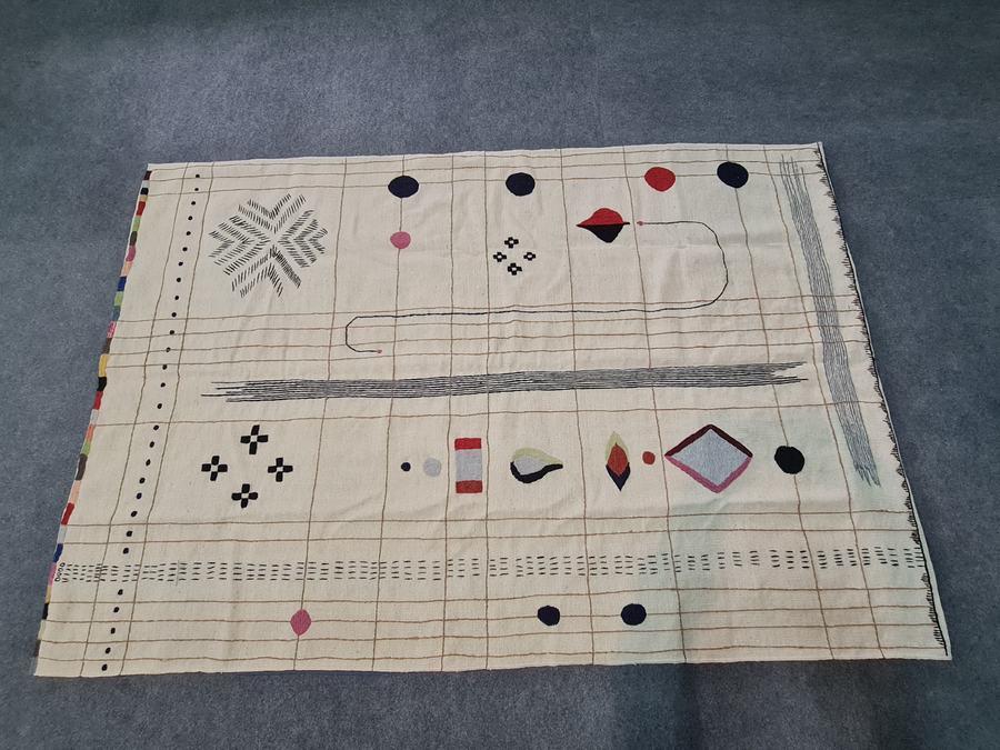 Hand-embroidered rug with a kilim design, handwoven on our own looms