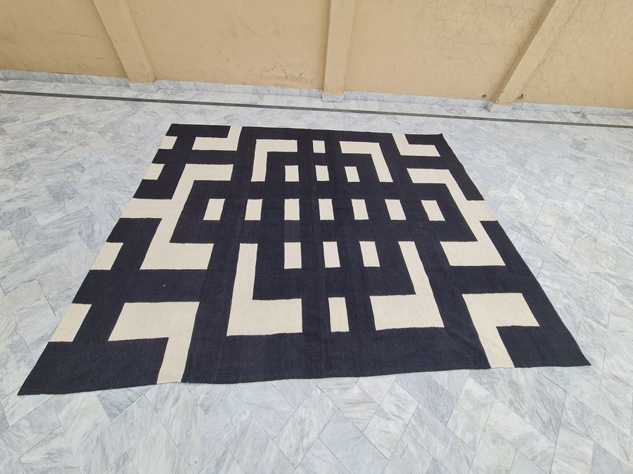 Flatweave kilim rug with a geometric design in black and white, woven to order