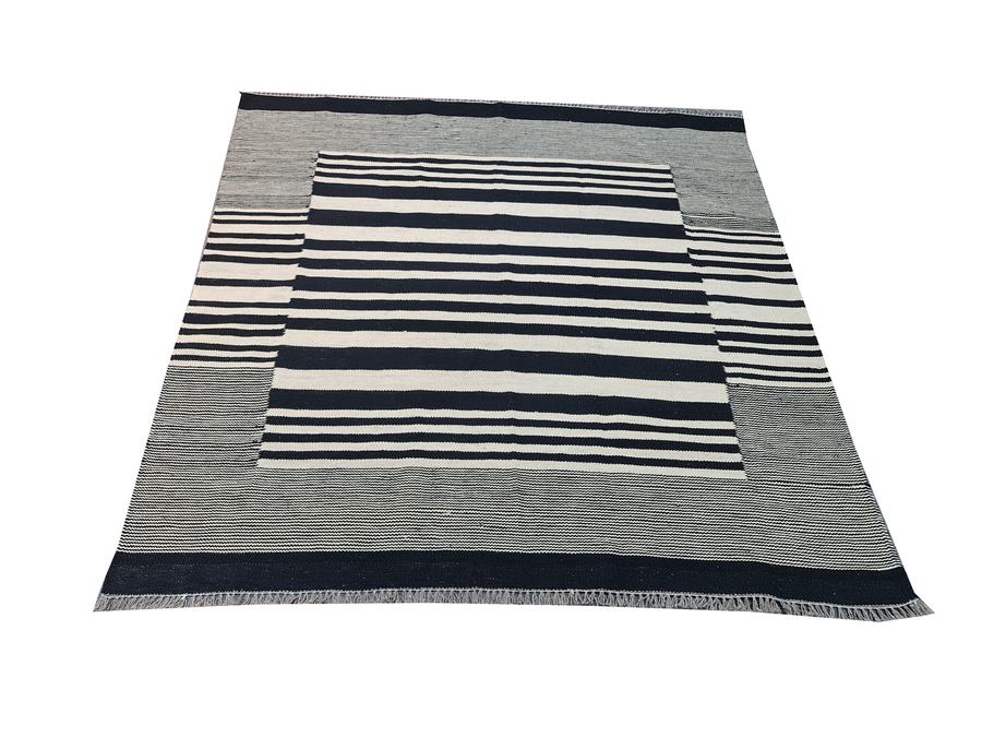 Flatweave kilim rug with a striped design in black and white, made to the customer's measurements