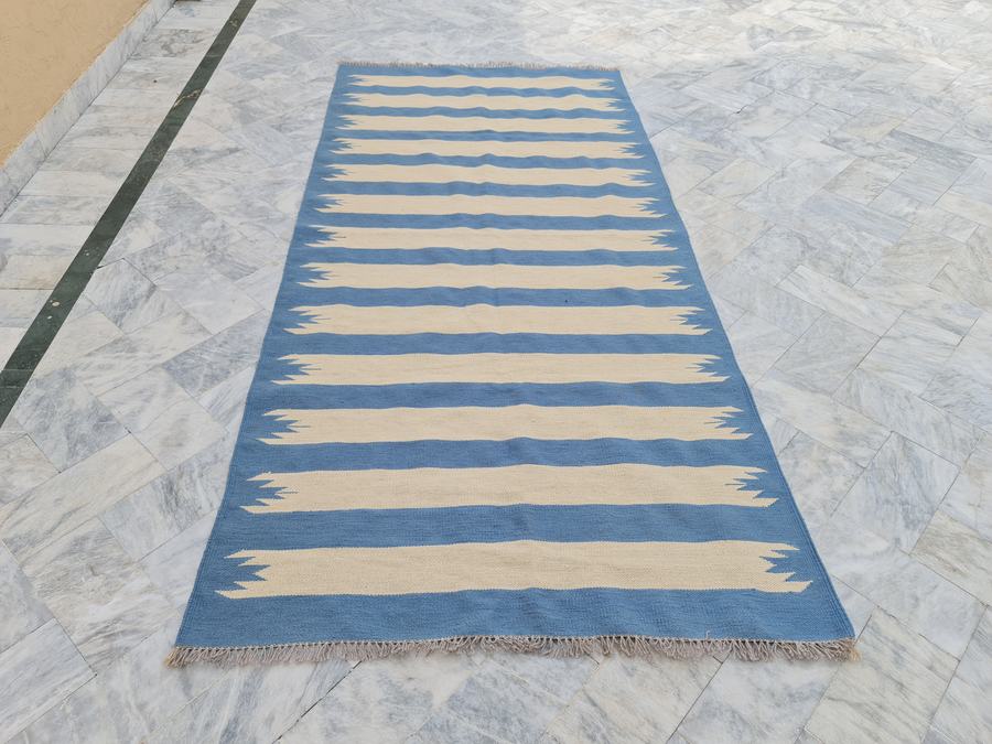 Flatweave kilim rug with a striped design in blue, made to the customer's measurements