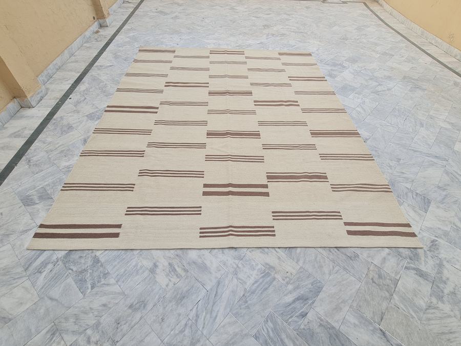 Custom flatweave kilim rug with a striped design in brown and ivory, handwoven in any size or colour