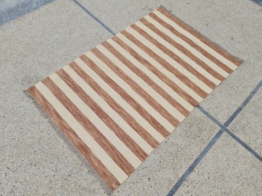 Flatweave kilim rug in brown and white, woven in our Lahore workshop
