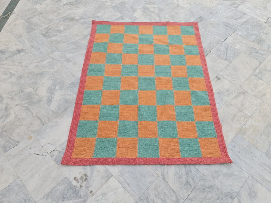Custom flatweave kilim rug with a checkered design, handwoven in any size or colour
