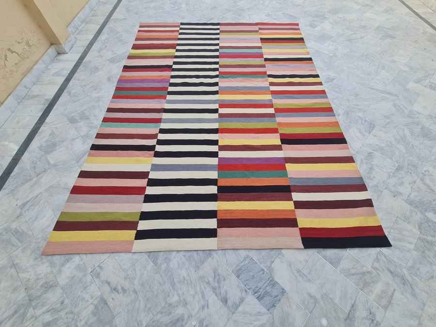 Flatweave kilim rug with a striped design, handwoven on our own looms