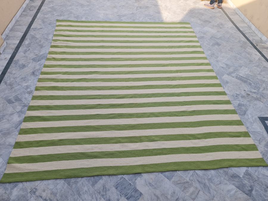 Flatweave kilim rug with a striped design in green and white, handwoven on our own looms