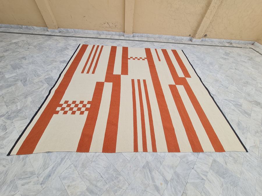 Custom flatweave kilim rug in orange and white, handwoven in any size or colour