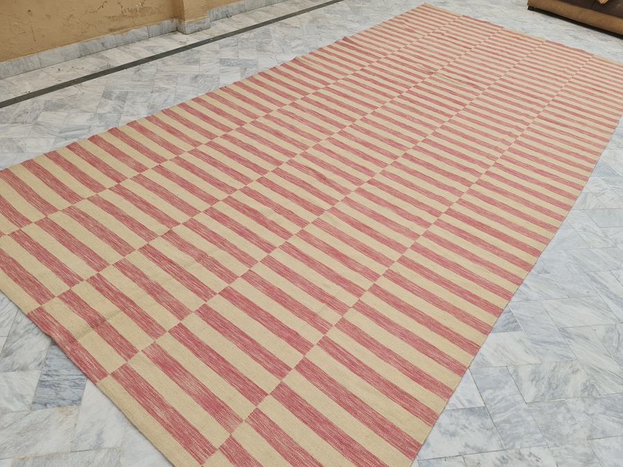 Flatweave kilim rug in pink and ivory, woven in our Lahore workshop
