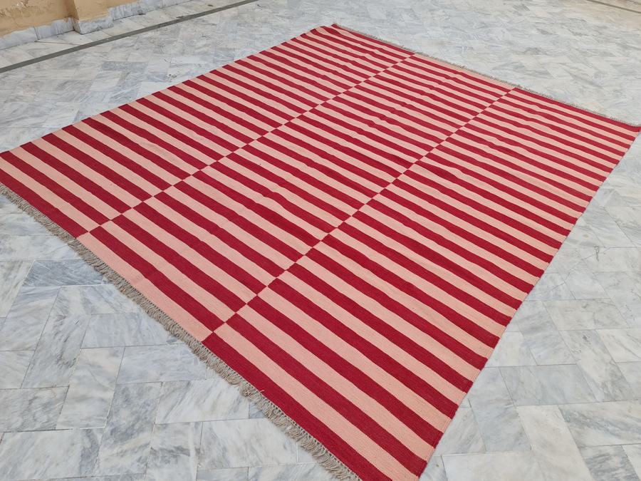 Flatweave kilim rug in pink and red, handwoven on our own looms