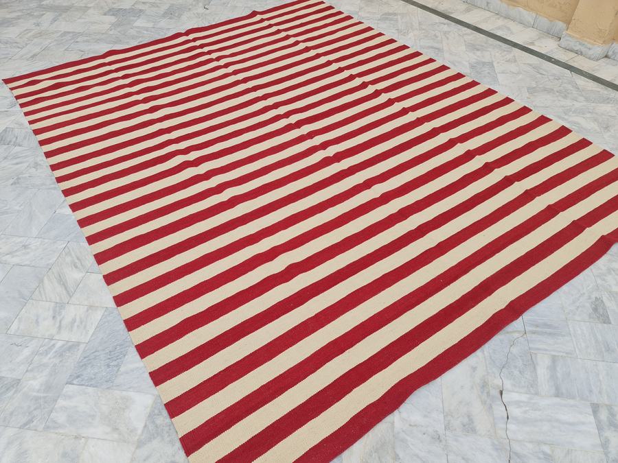 Flatweave kilim rug with a striped design in red and cream, made to the customer's measurements